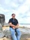 Purushothama K